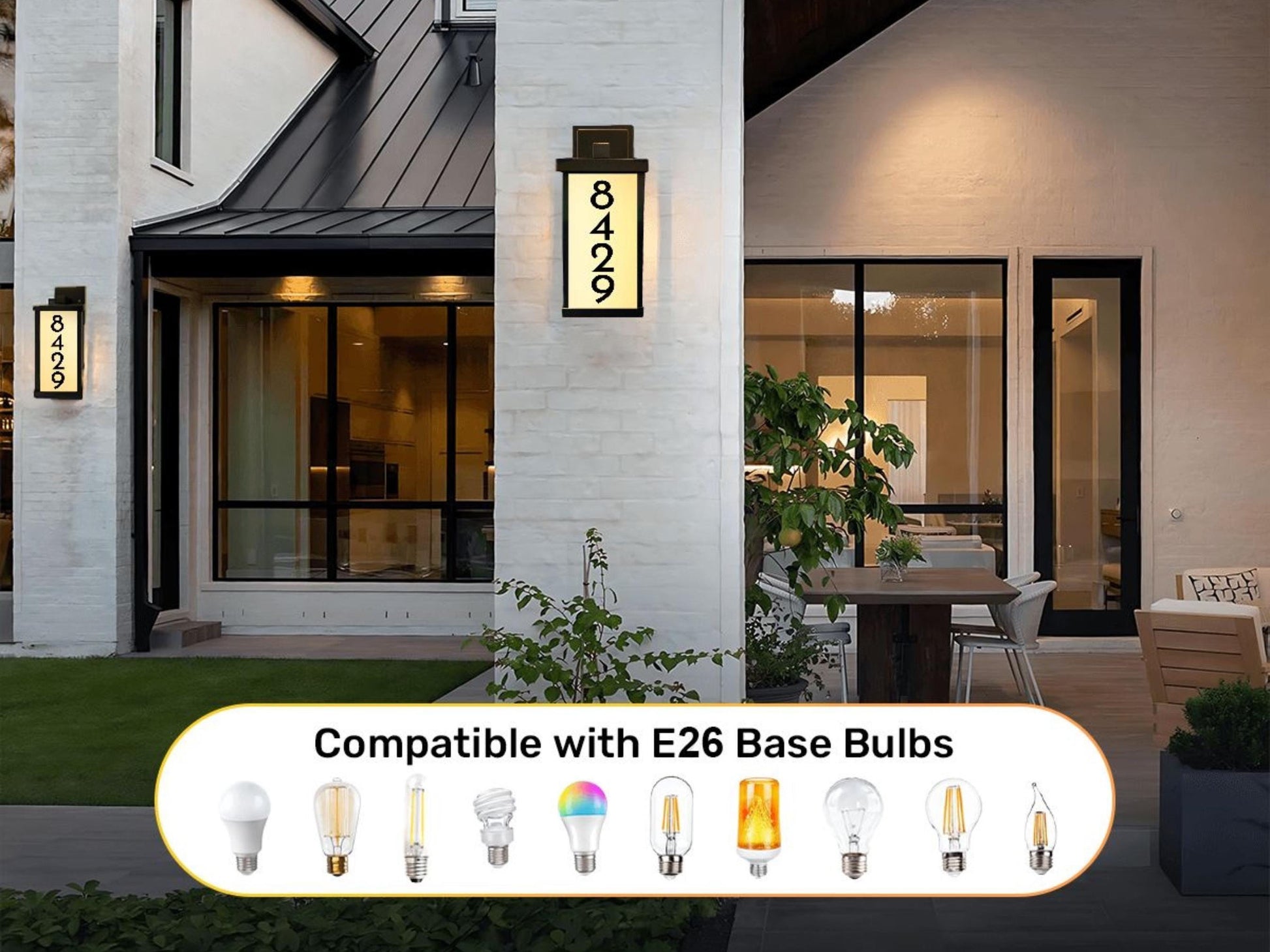 a modern house with a large window and a sign displaying the address number. The house has a patio area with a dining table and chairs. The image also includes a list of compatible light bulb types for the E26 Base Bulbs.