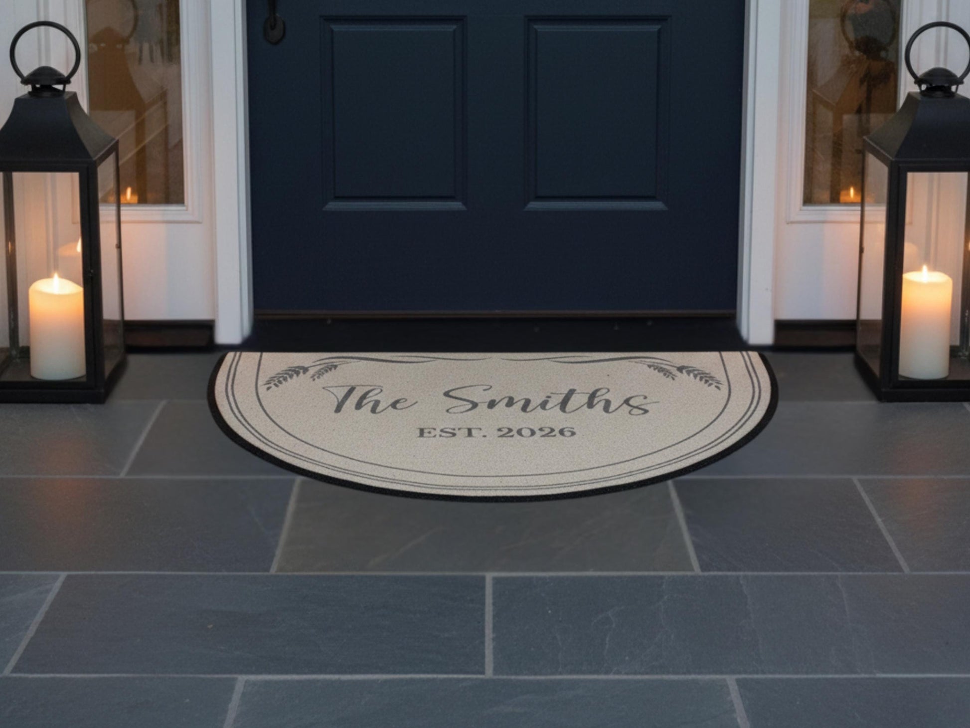 a door with a decorative mat in front of it, which displays the name "The Smiths" and the year "EST. 2026". The mat is placed on a tiled floor, with two lanterns on either side of the door.