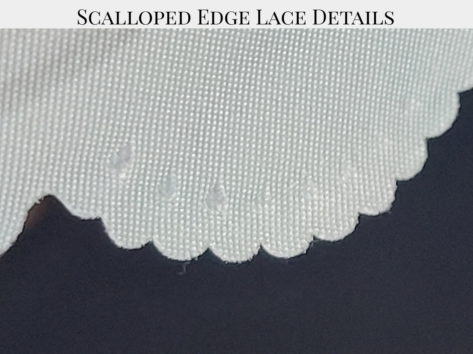 a close-up view of a scalloped edge on a fabric, with the edge of the fabric appearing slightly curled and folded.