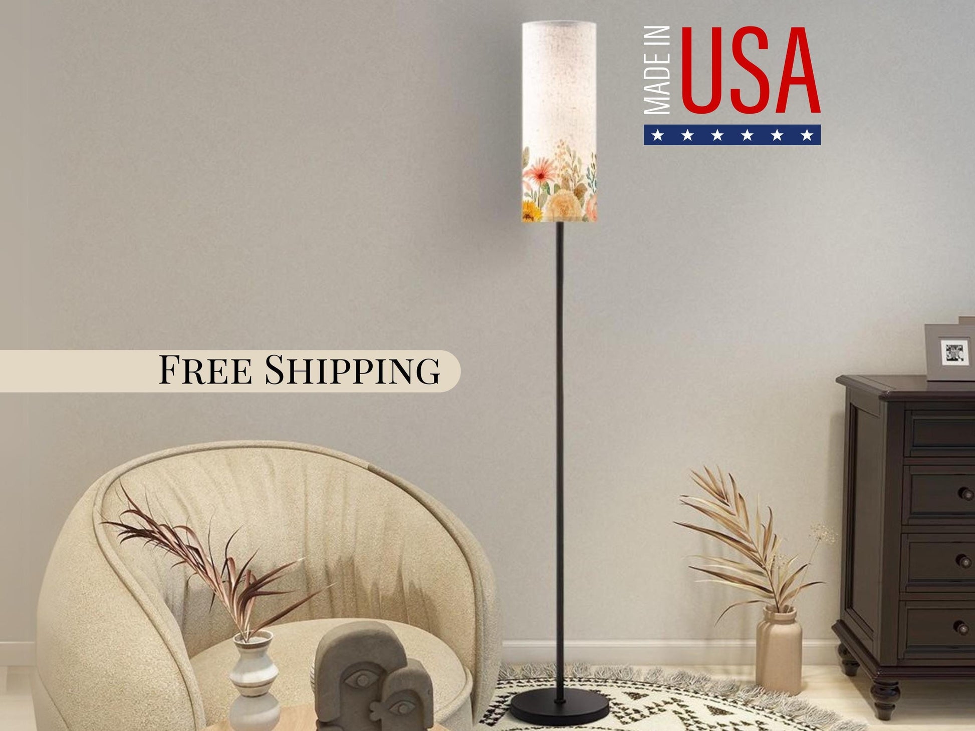 a living room with a beige armchair, a floor lamp with a floral lampshade, and a wooden dresser. The wall behind the furniture displays a "Made in USA" sign, and there is a "Free Shipping" banner below it.